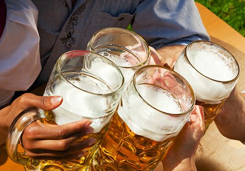 hands holding beers
