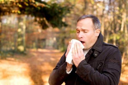 man sneezing