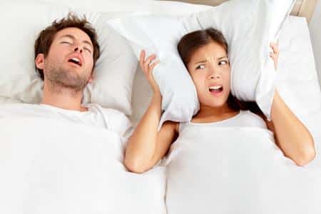 snoring husband in bed