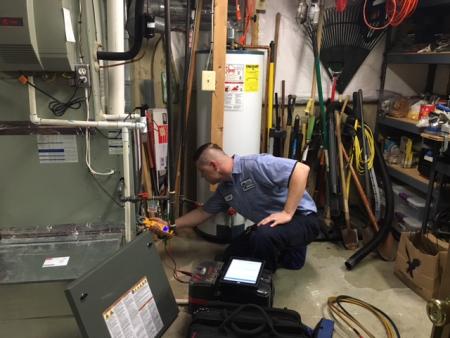 technician servicing heater