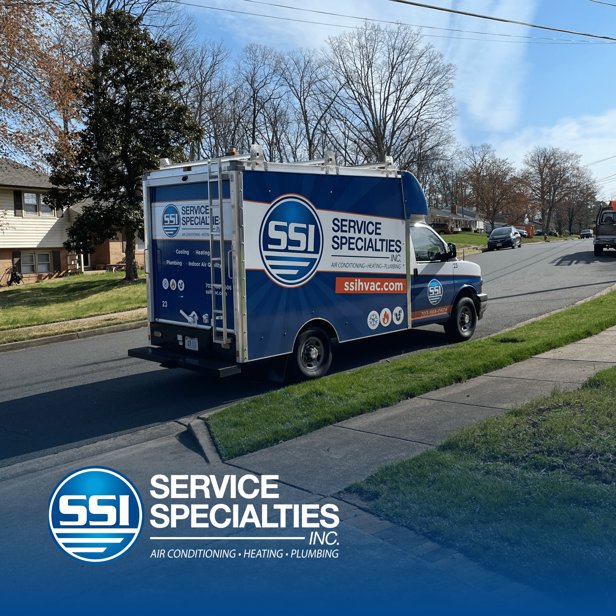 SS service truck parked on a residential street with branded logo and website displayed