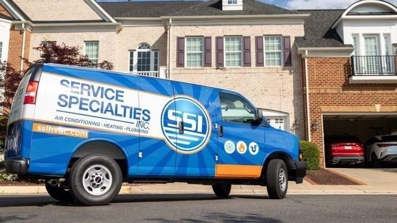 Service Specialities Inc. van parked outside of house.