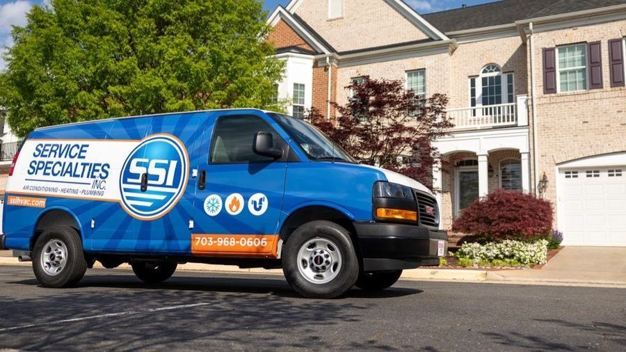 Service Specialties van parked outside of home for sewer repair.